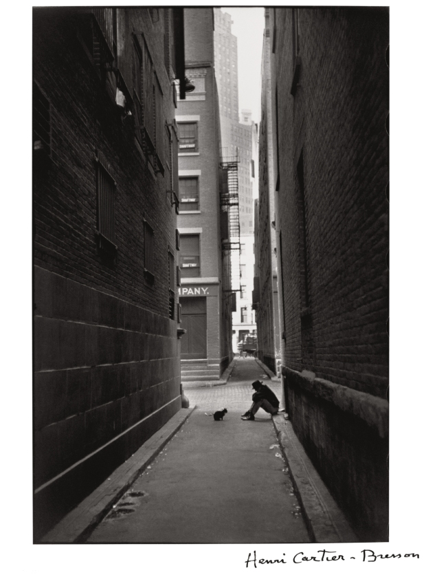 Henri Cartier-Bresson, Man in the street with his dog, New York, 1932